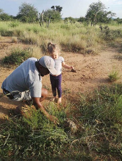 Family Safari guides rangers Teaching kids about wildlife