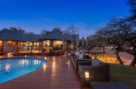 Tau Game Lodge Lodge and Pool at Night